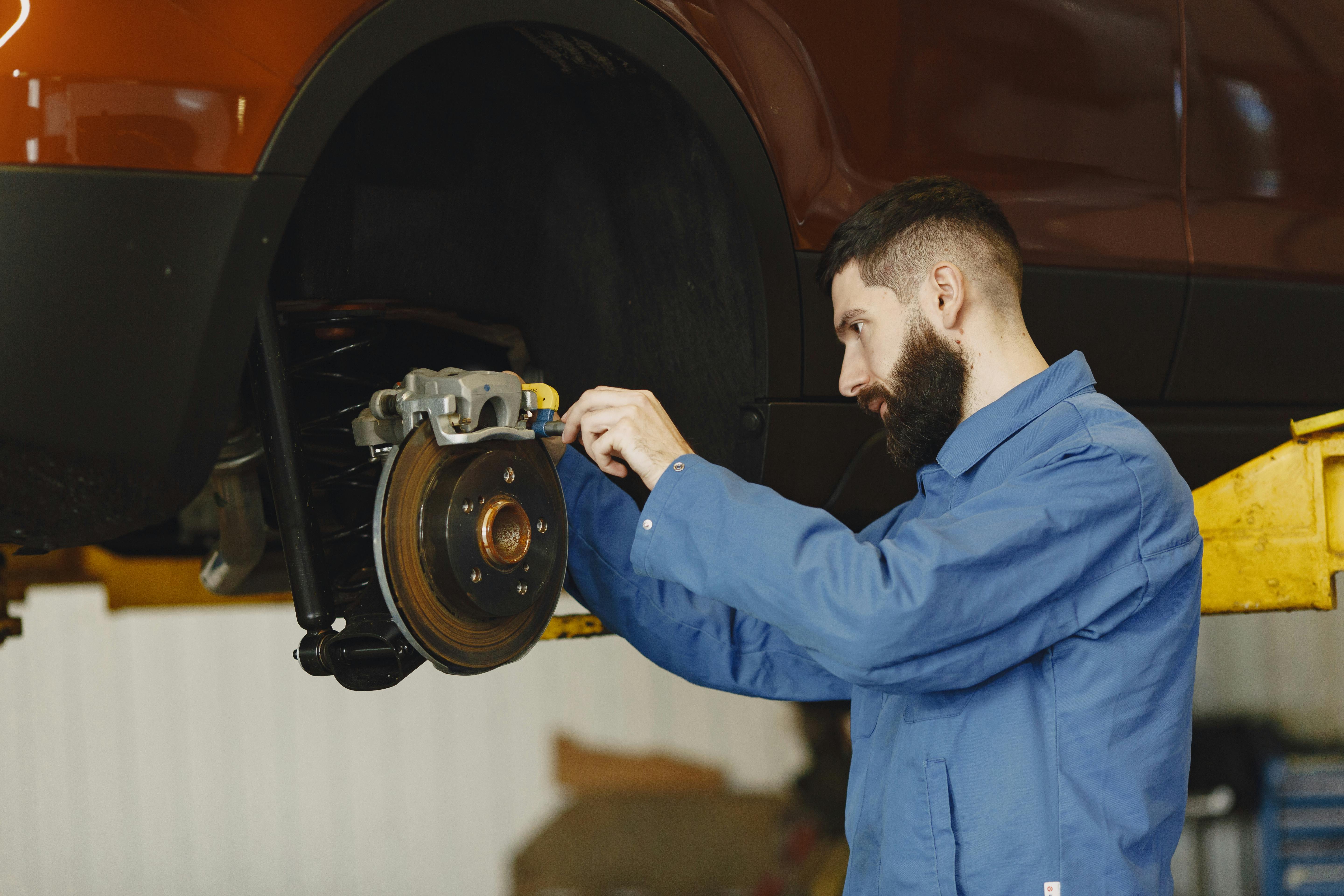 Close-up of a brake disc, caliper and pad assembly