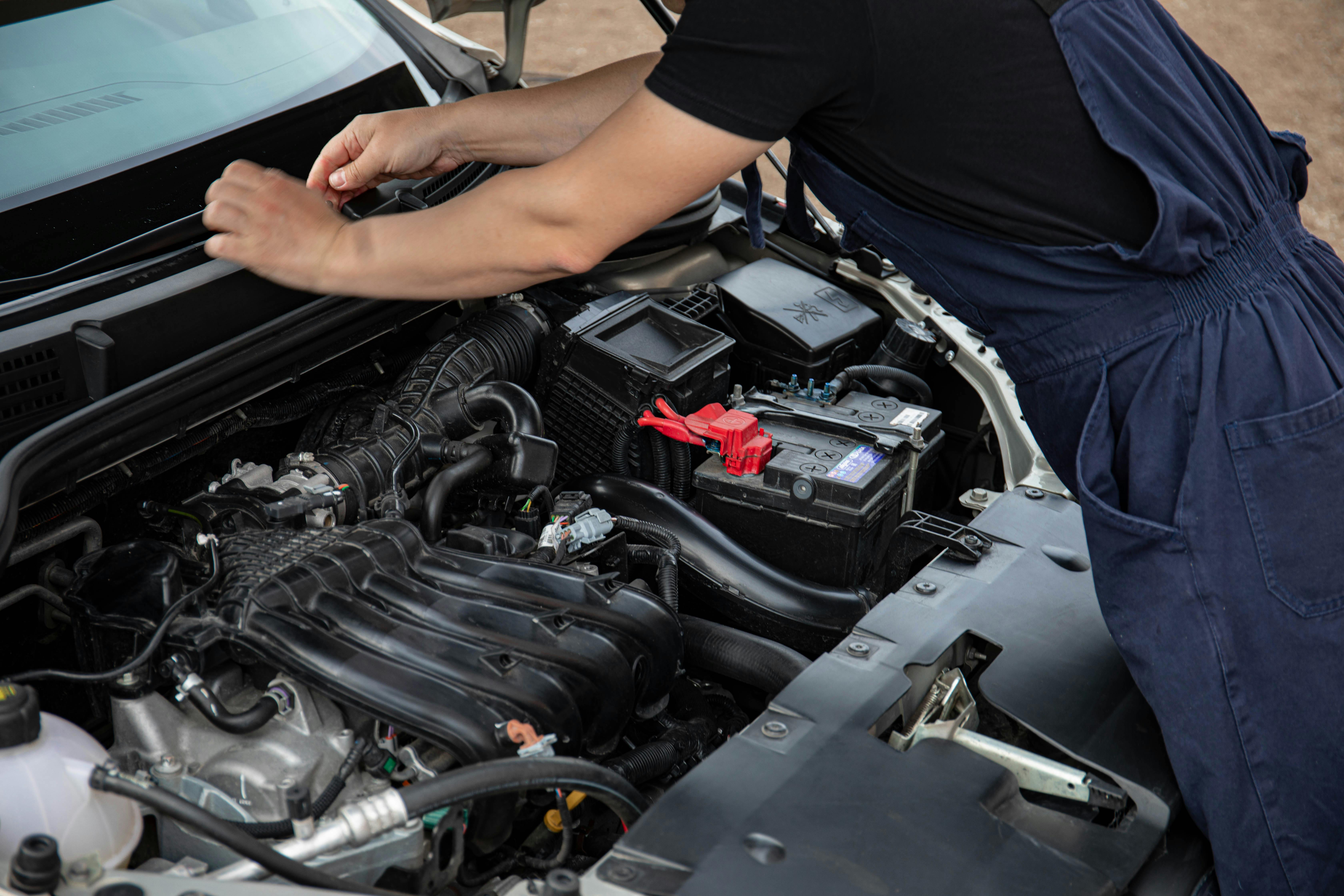 Mechanic performing general vehicle repairs in a professional workshop